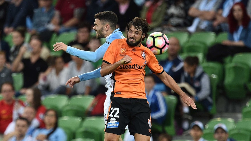Melbourne City player Anthony Caceres (left) and Brisbane Roar player Thomas Broich are seen in action during the round 9 A-League match between Melbourne City and Brisbane Roar at AAMI Park in Melbourne