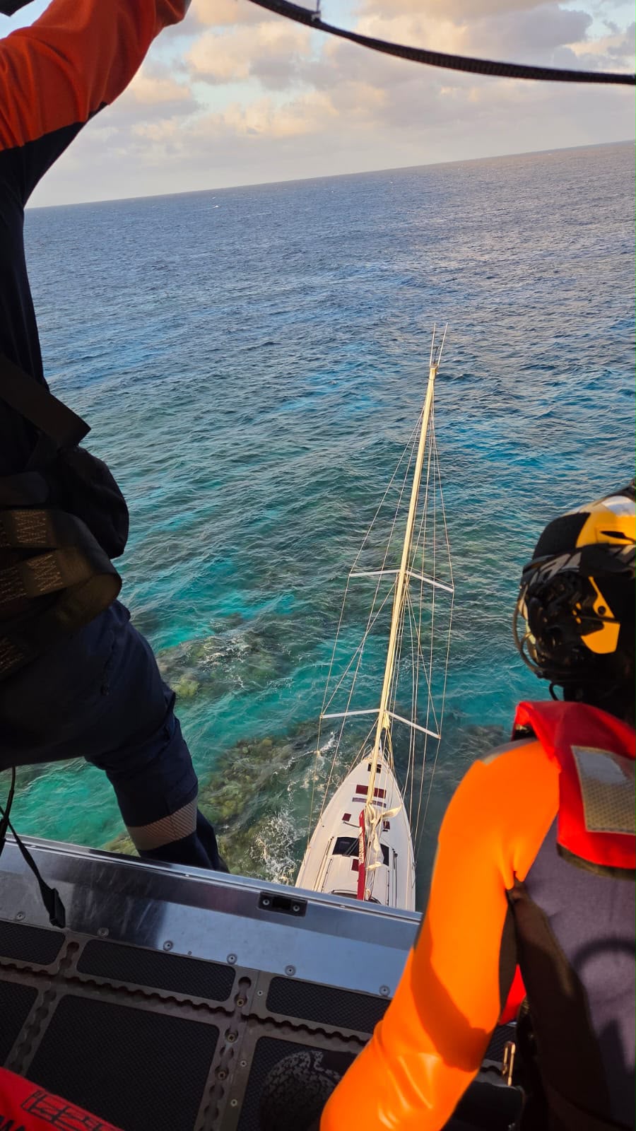 Helicopter winches family to safety after Whitsundays yacht crash