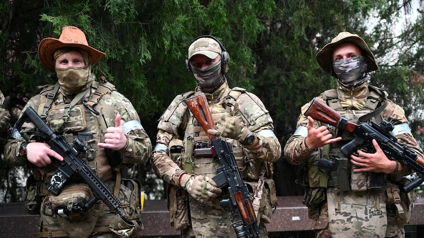 Fighters of Wagner private mercenary group pose for a picture.