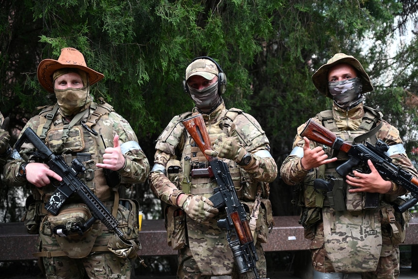 Fighters of Wagner private mercenary group pose for a picture.