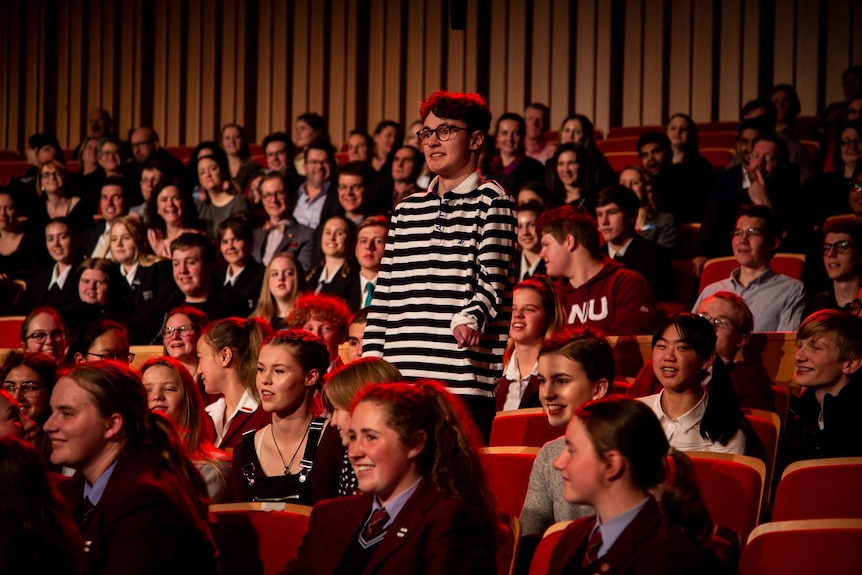 Disabled actor William Rees asks a question at the Q&A high school special