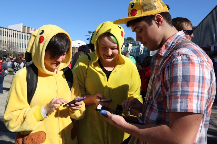 Pokemon Go players dressed as the character Pikachu.