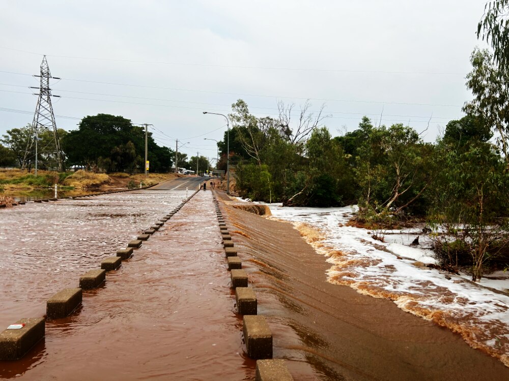 a flooded road bridge