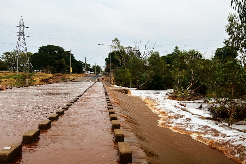 a flooded road bridge