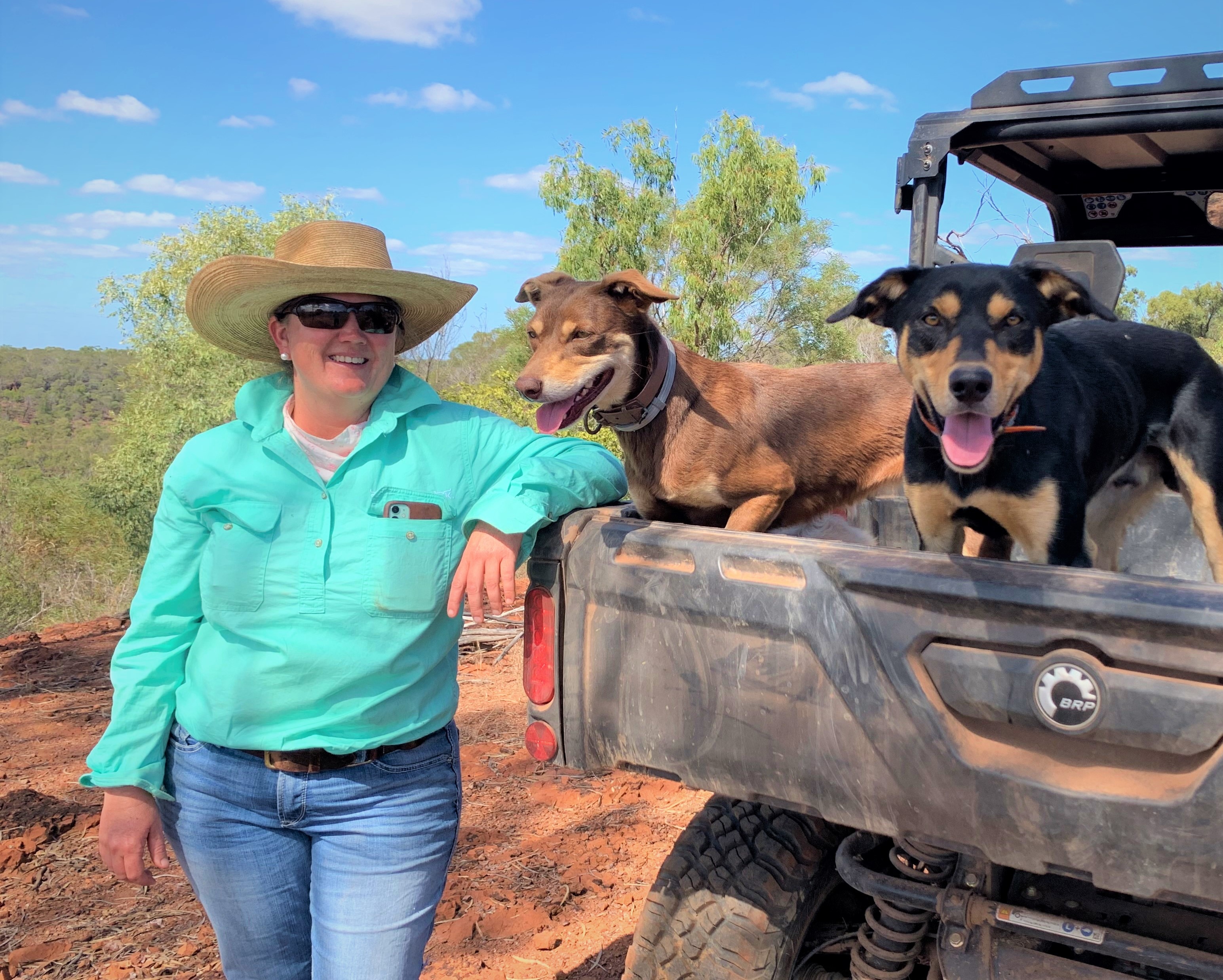 woman with cattle dogs on station
