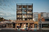 A mock-up of an apartment building next to a train station on a street in Brunswick in Melbourne.