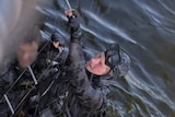 Prince Harry works alongside Royal Australia Navy Clearance divers.