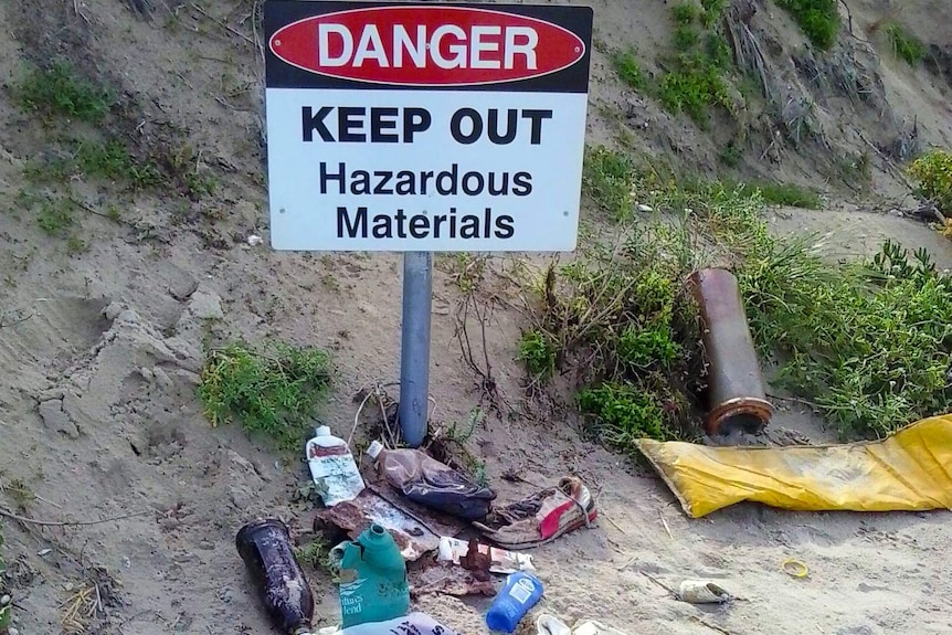 A sign saying Keep out hazardous materials