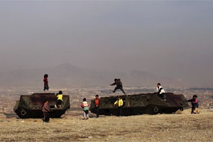 Children play on discarded Russian military vehicles on a hill overlooking the city of Kabul (Spencer Platt/Getty Images)