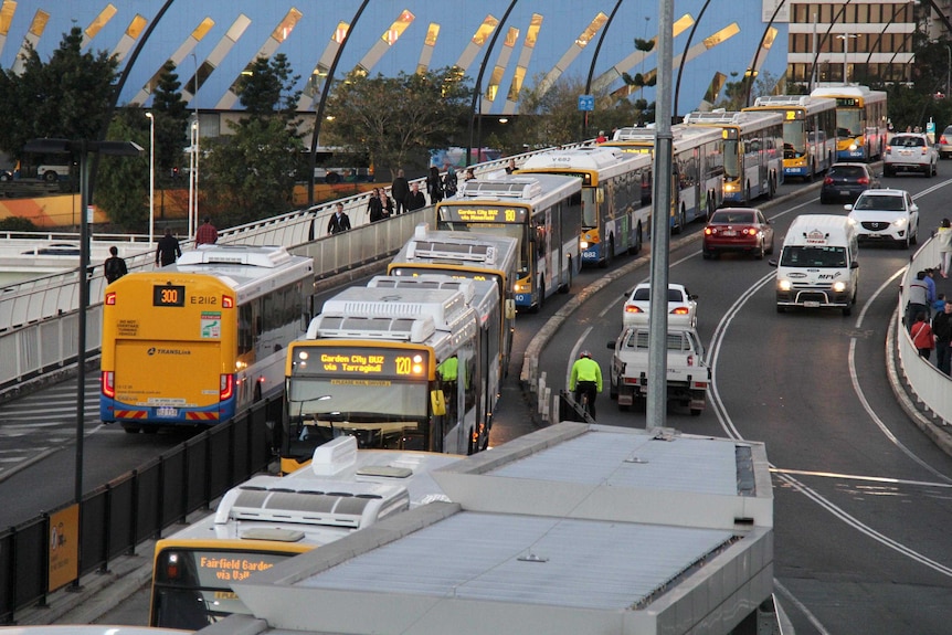 Buses queue on the Victoria Bridge as they approach the Cultural Centre busway station in Brisbane.