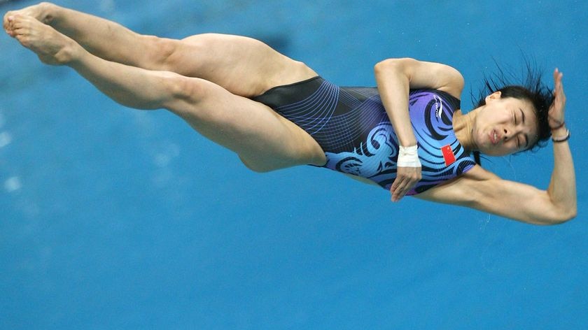 Guo Jinging dives during the women's 3m springboard diving final at the Olympic on August 17, 2008.