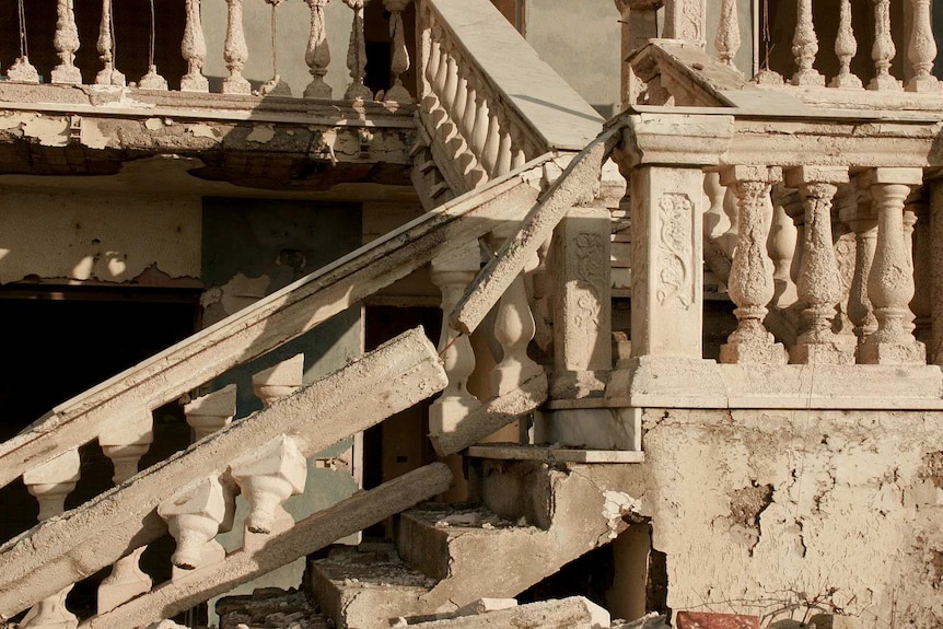 A dilapidated home crumbling into the sea at Castel Volturno, Italy.