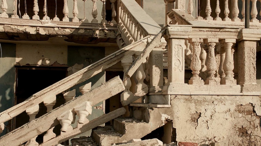 A dilapidated home crumbling into the sea at Castel Volturno, Italy.