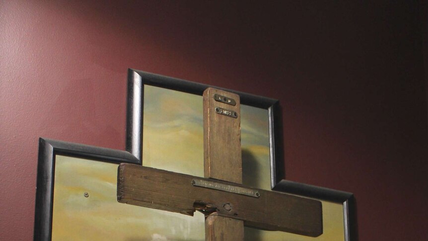 The wooden cross of an unknown Australian soldier is on display at the Newcastle RSL.