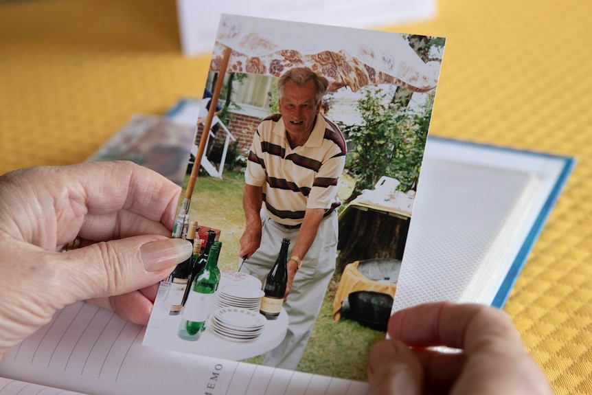 Frances Logan holds a photo of her father.