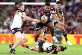 Brumbies players attempt to tackle Queensland Reds prop Taniela Tupou