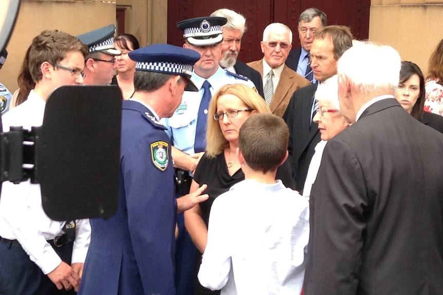 Andrew Scipione comforts the family of murdered police officer Bryson Anderson