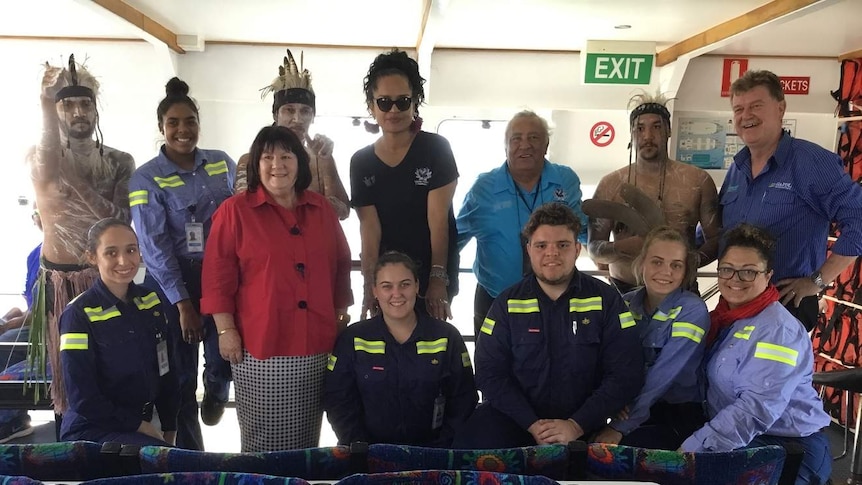 Group of people inside a boat.