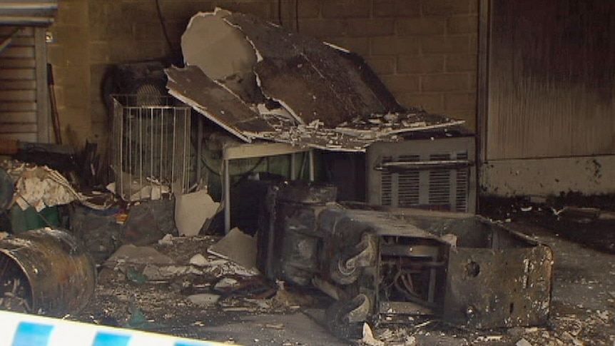 Fire damages possessions inside a garage