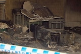 Fire damages possessions inside a garage