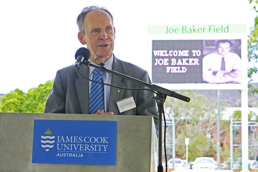 Man stands at podium