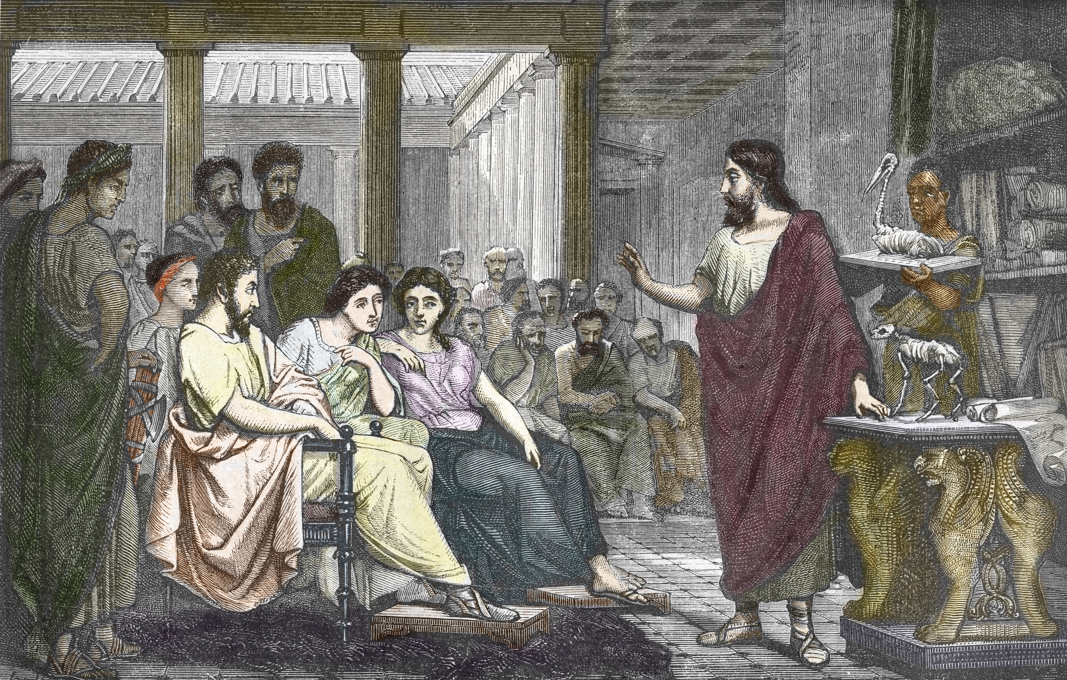 Old picture of man holding hand up in crowd 