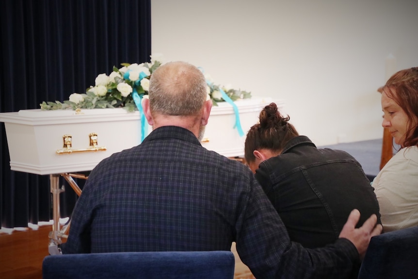Shyanne-Lee Tatnell's mother cries at her daughter's funeral.