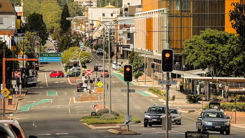 A picture of the Toowoomba CBD with city centre sign, buildings, street lights and traffic lights