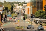 A picture of the Toowoomba CBD with city centre sign, buildings, street lights and traffic lights