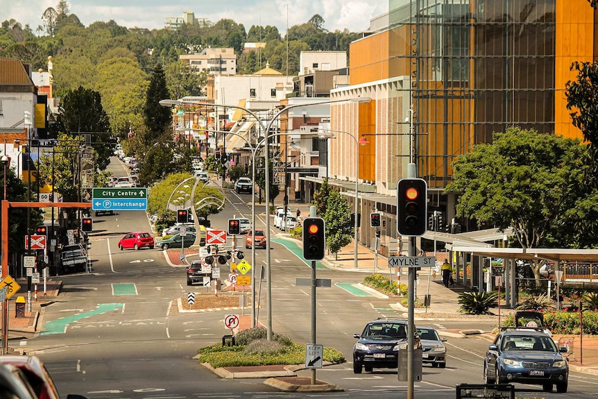 A picture of the Toowoomba CBD with city centre sign, buildings, street lights and traffic lights