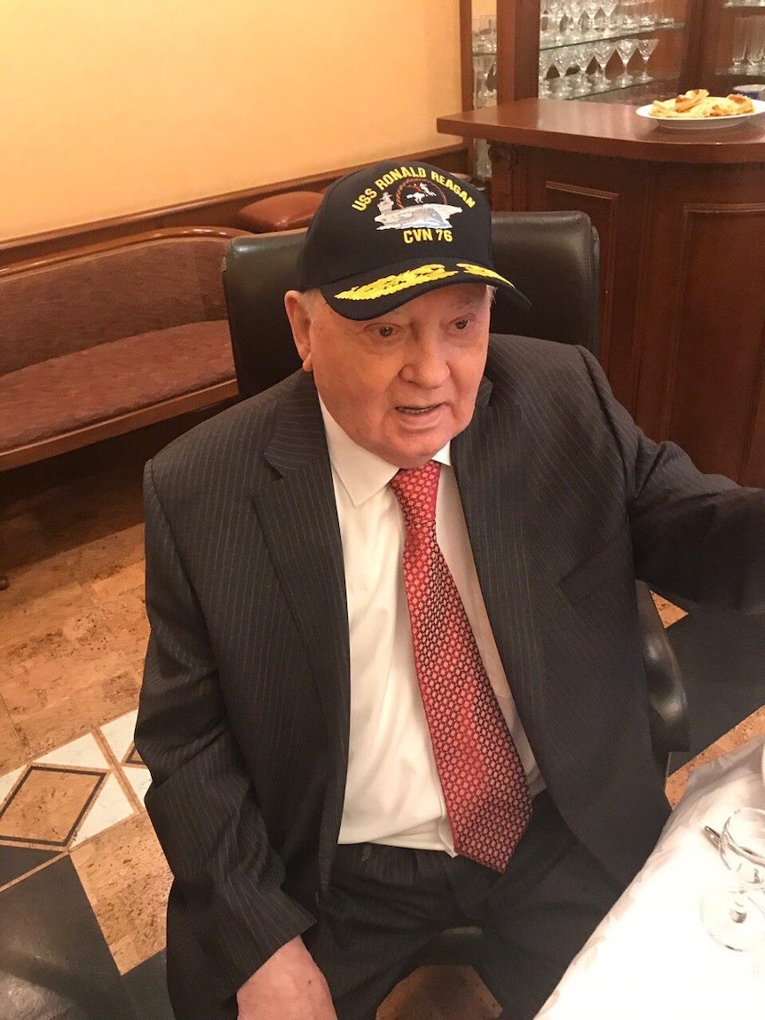 Mikhail Gorbachev in an office chair in a cap
