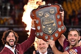 Johnathan Thurston and Cameron Smith of the Maroons lift the Origin shield.