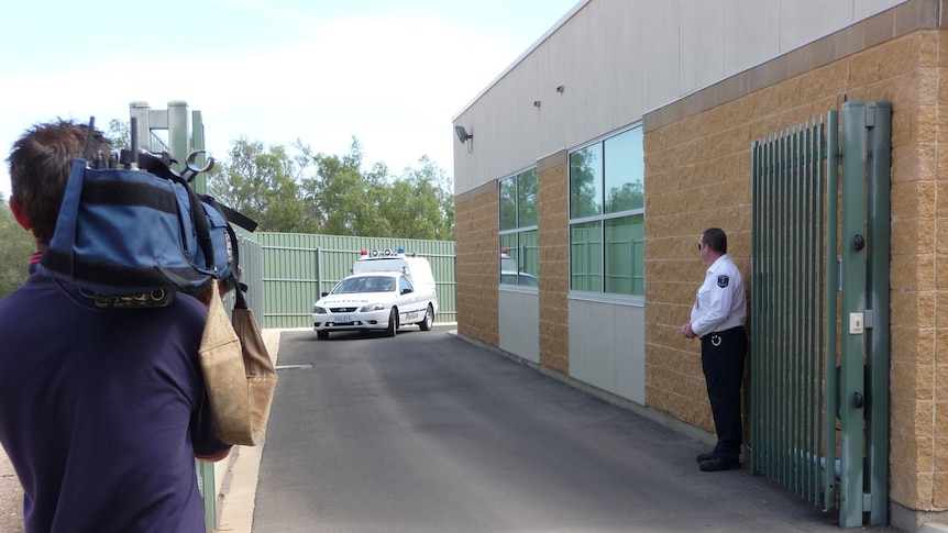 Demal Behari is driven away from Port Pirie Magistrates Court