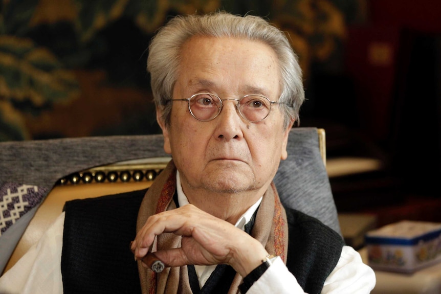 Jacques Verges listens during a news conference.