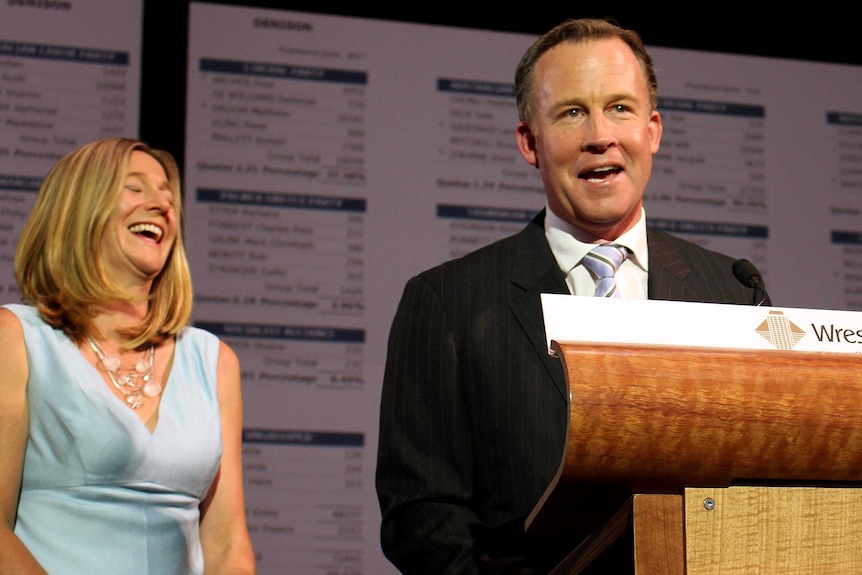 Will Hodgman addresses supporters as his wife, Nicola, shares a laugh.