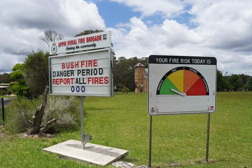 Bushfire danger signs by the side of a road