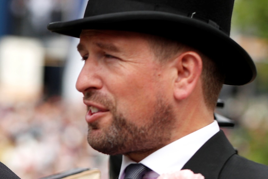 Mike Tindall and Peter Phillips wearing top hats and riding in a carriage.