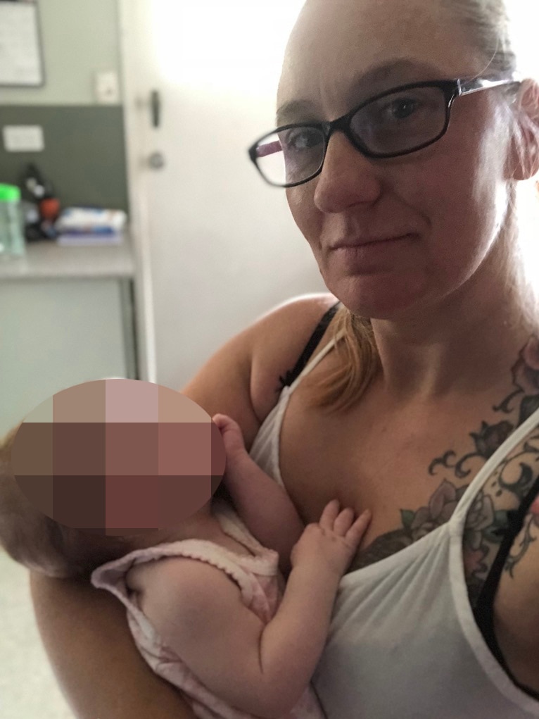Brisbane mum of five and altruistic surrogate Charli Lee holds the baby she gave birth to.
