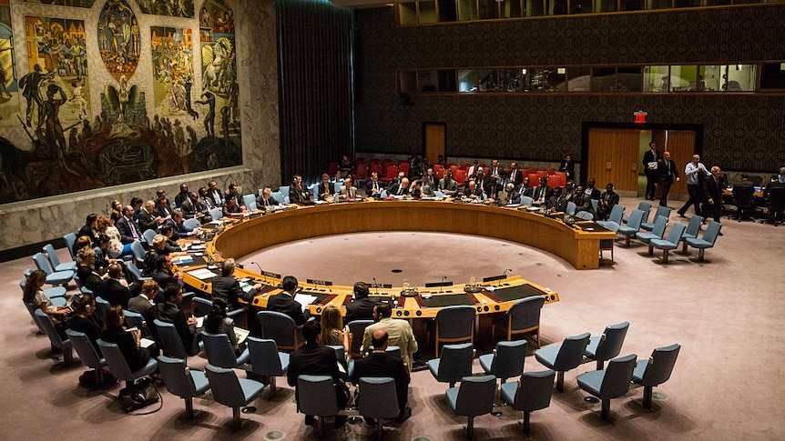 The UN security council room with an enormous artwork hanging on the wall