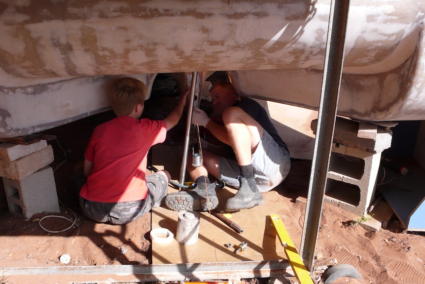 children help boat build