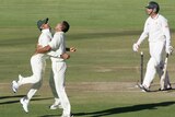 Bangladesh players Nasir Hossain and Ziaur Rahman celebrate the wicket of Zimbabwe's Brendan Taylor.