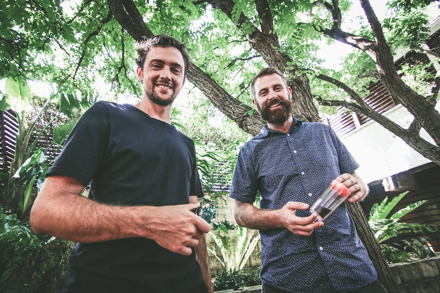 Antony Martin and Jamie Flynn standing underneath a canopy of leaves