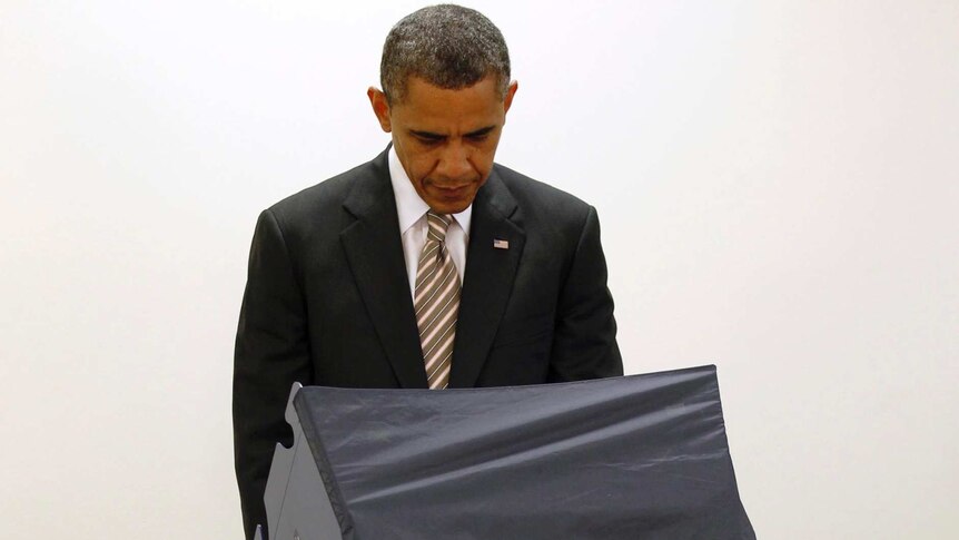 US president Barack Obama casts his vote early at the Martin Luther King Community Centre in Chicago.