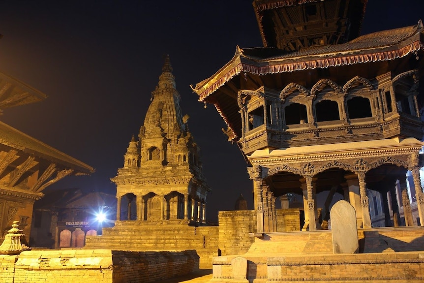 Two temples are photographed at night