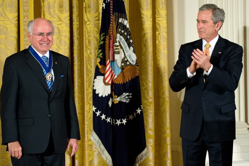 George W Bush applauds John Howard