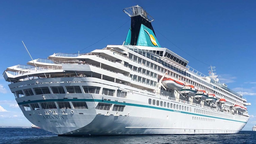 A cruise ship on the water, photographed from below.