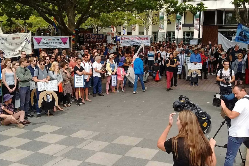 Canberrans rally in Garema Place demanding better treatment of asylum seekers.