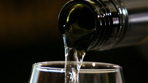 A bottle of Australian white wine is poured into a glass. (Greg Wood: AFP)