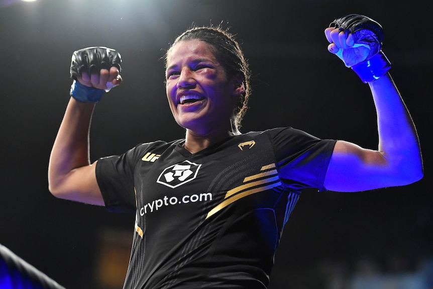 A female UFC fighter celebrates a victory in Las Vegas.