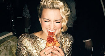 Woman eating pizza teaser box picture